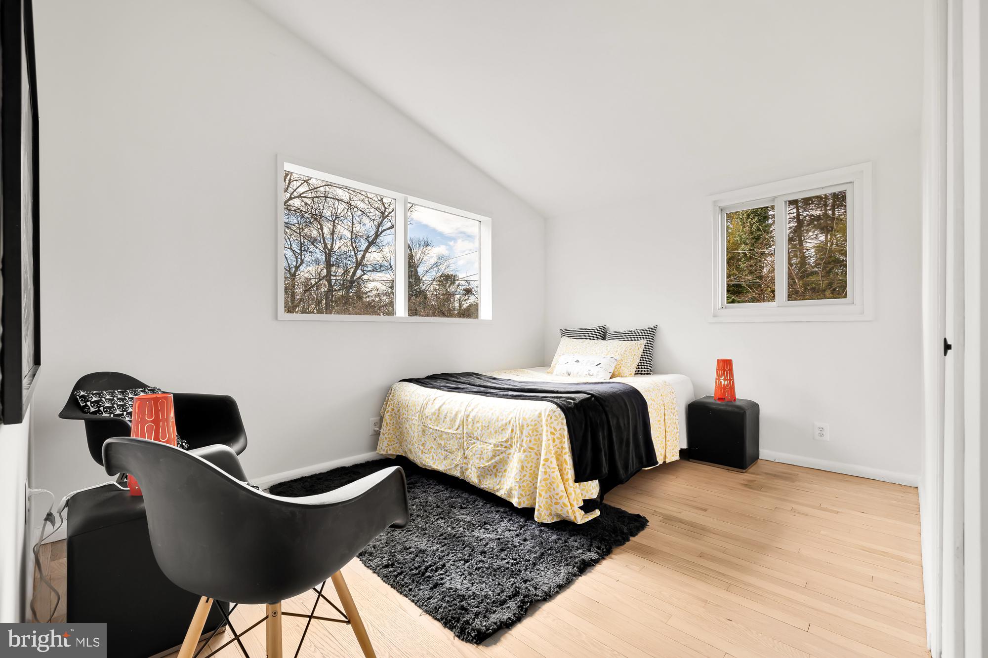 11500 Regnid Drive Silver Spring, MD 20902 - Photo 27 of 50 a bedroom with a bed and chair