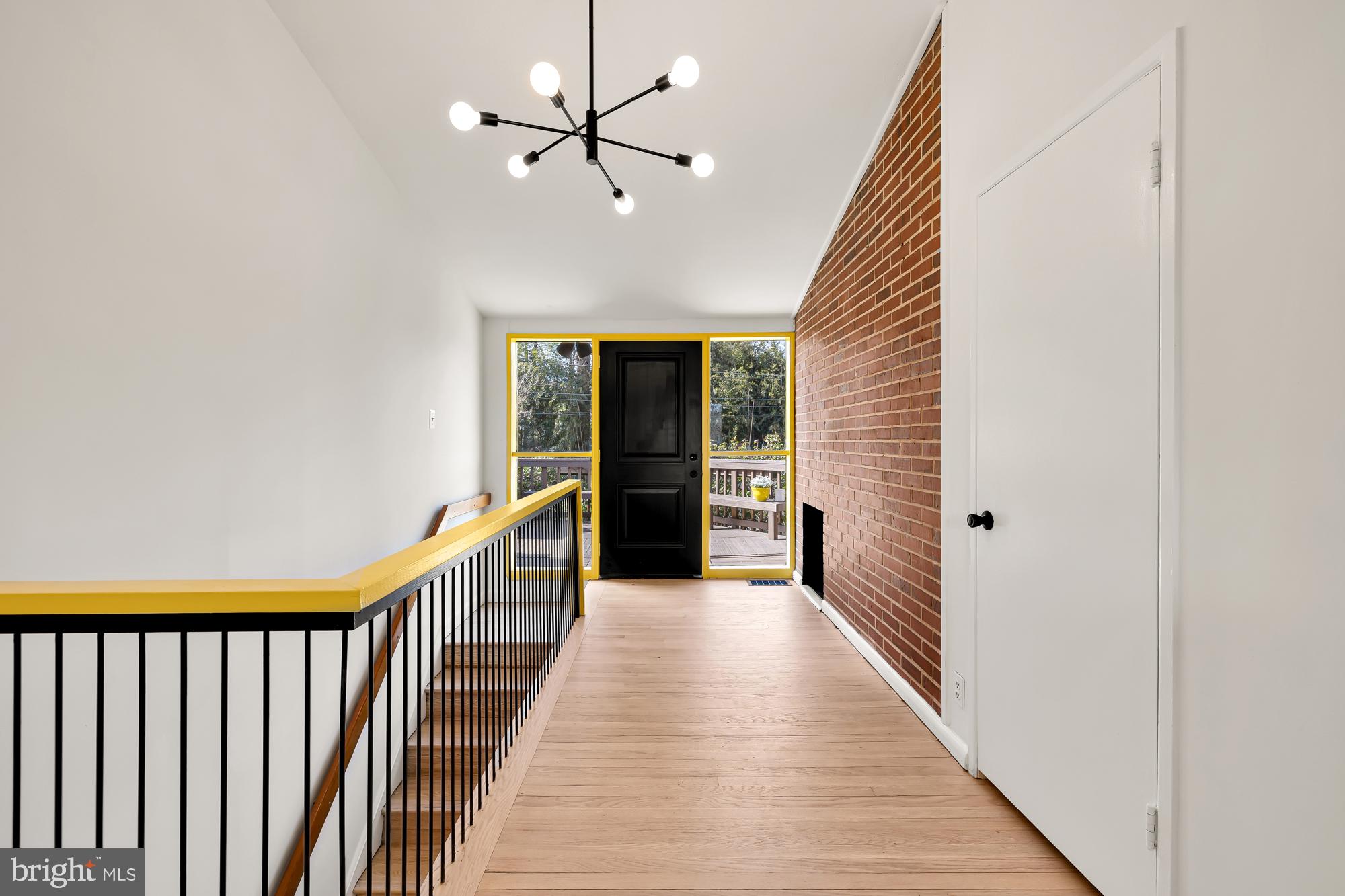 11500 Regnid Drive Silver Spring, MD 20902 - Photo 33 of 50 a view of a hallway with wooden floor and staircase