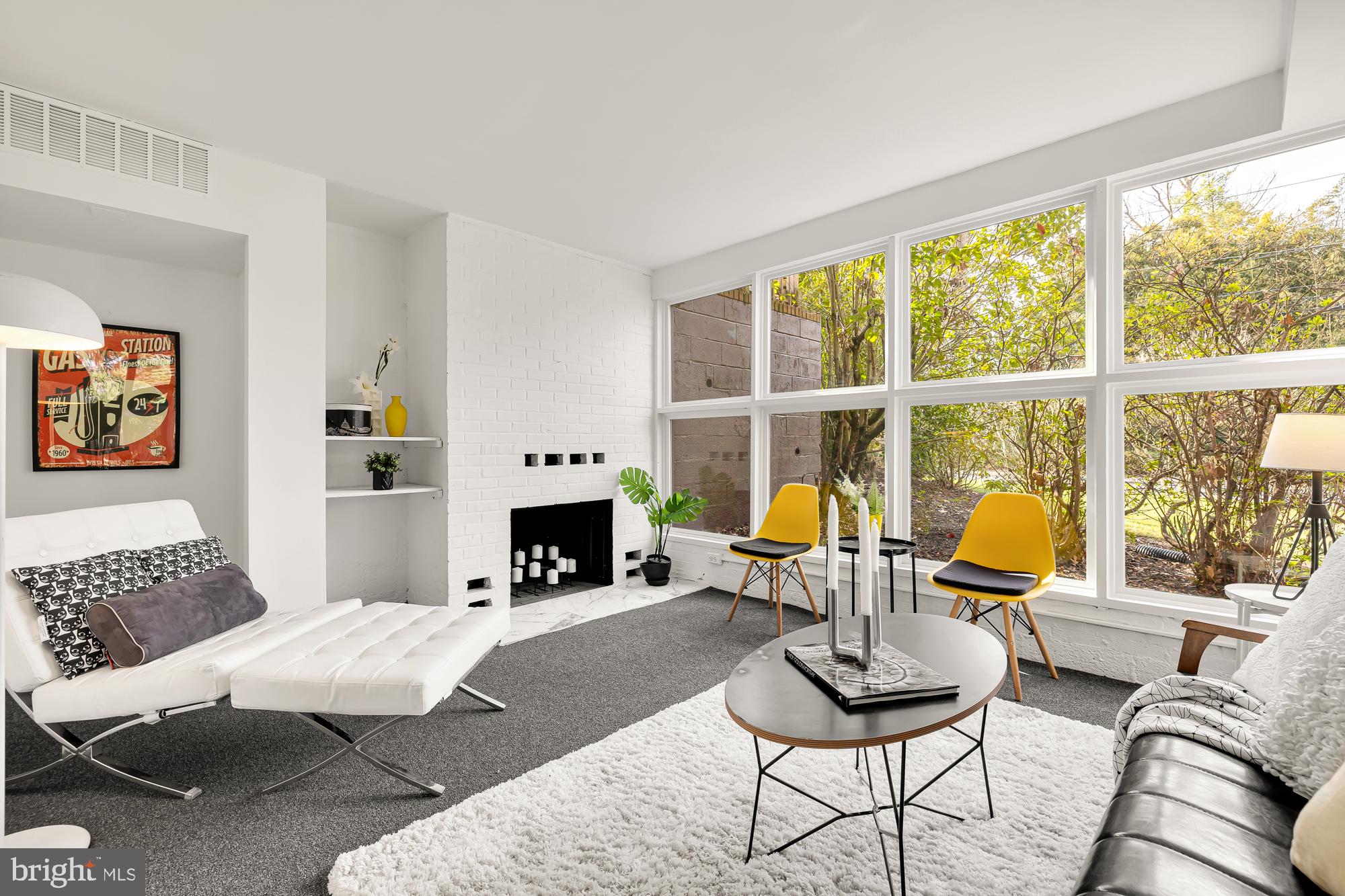 11500 Regnid Drive Silver Spring, MD 20902 - Photo 34 of 50 a living room with furniture a fireplace and next to a window