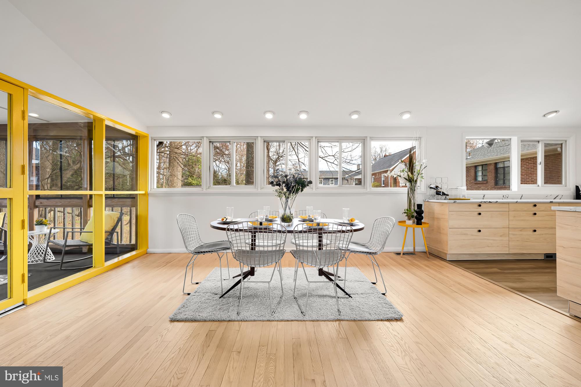 11500 Regnid Drive Silver Spring, MD 20902 - Photo 8 of 50 a living room with furniture a rug kitchen view and a large window