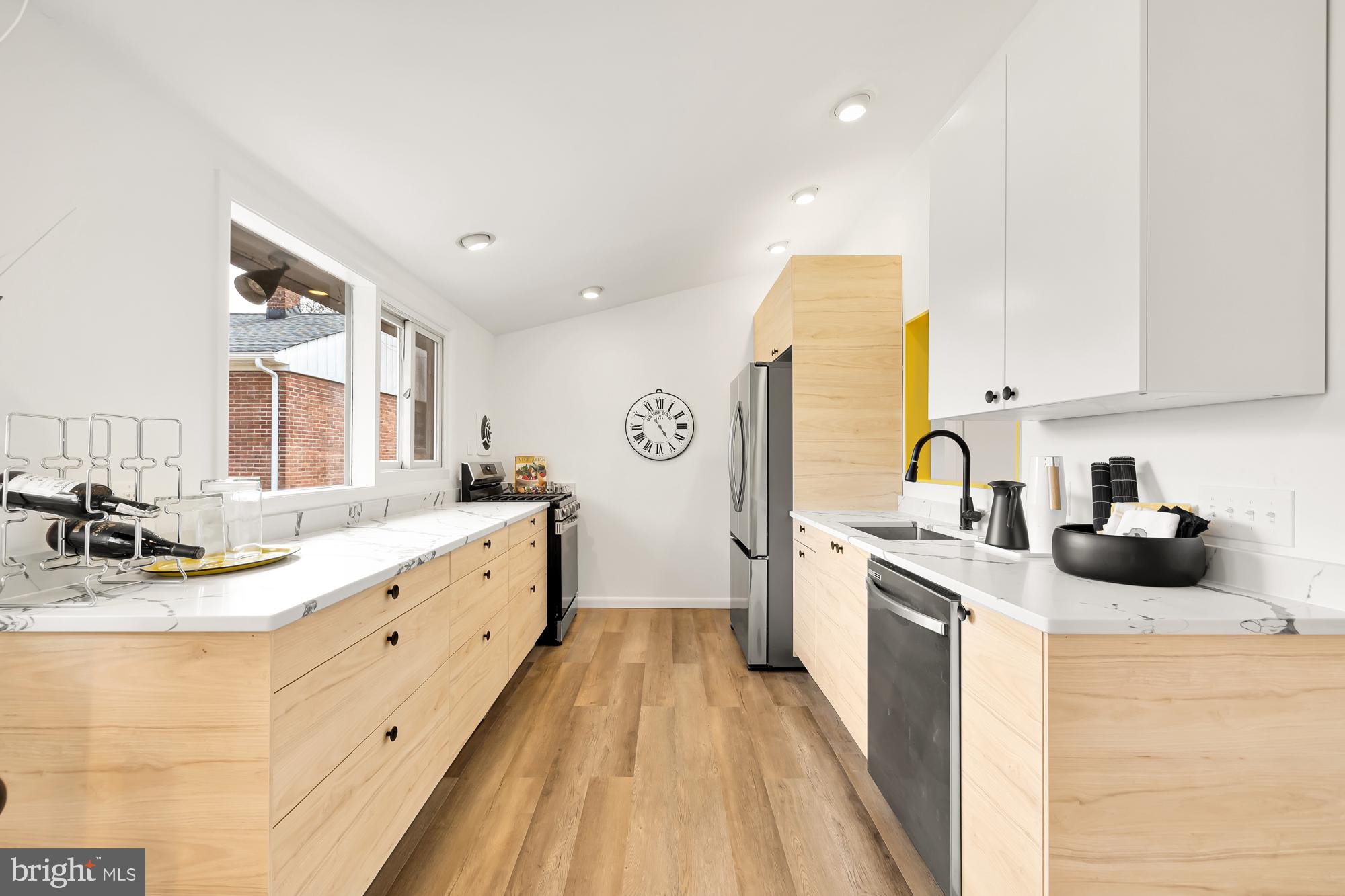 11500 Regnid Drive Silver Spring, MD 20902 - Photo 9 of 50 a large kitchen with a lot of counter space and wooden floor
