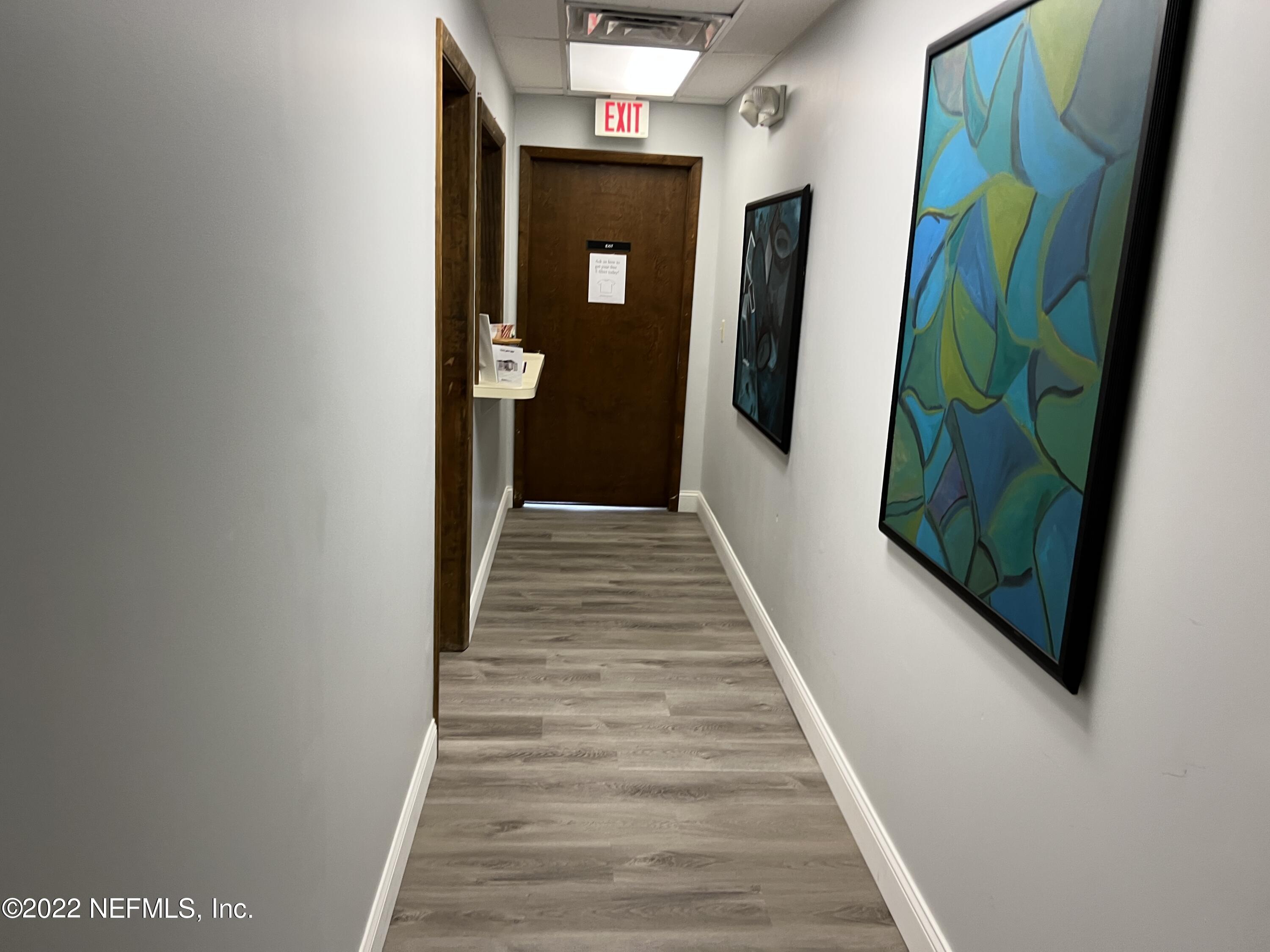 5819 Booth Road Jacksonville, FL 32207 - Photo 12 of 35 exit hallway with new flooring