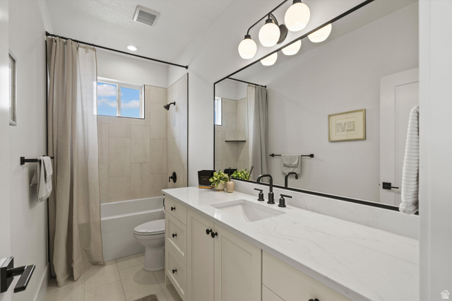 3349 Oxford Loop Morgan, UT 84050 - Photo 24 of 47 Full bath with vanity, shower / bath combination with curtain, and light tile patterned floors
