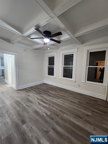 65 Halstead Street, Unit 1 Kearny, NJ 07032 - Photo 8 of 15 a view of an empty room with wooden floor and a window