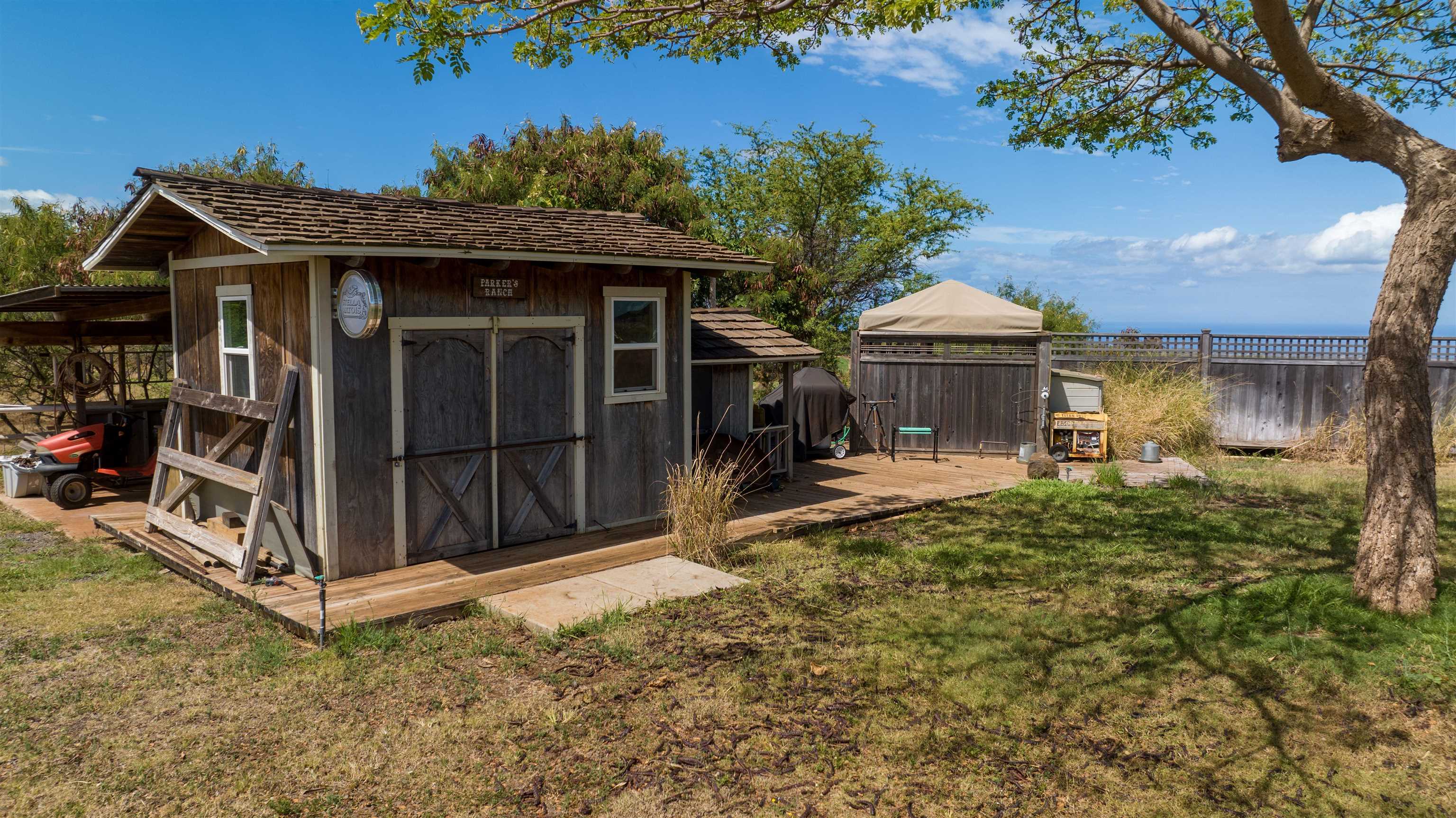 80 Opalipali Place Kula, HI 96790 - Photo 14 of 15 a view of a house with a small yard and a patio