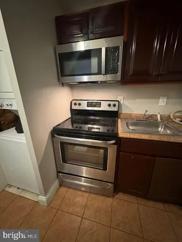a kitchen with a stove and a microwave