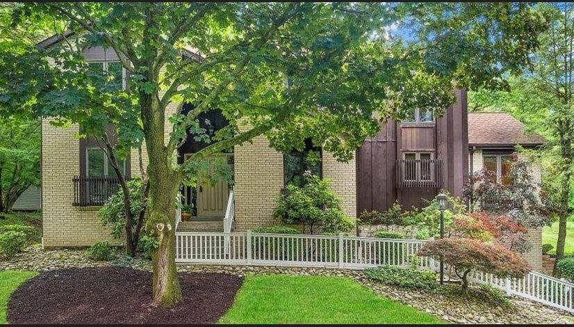 a view of a house with a yard and plants