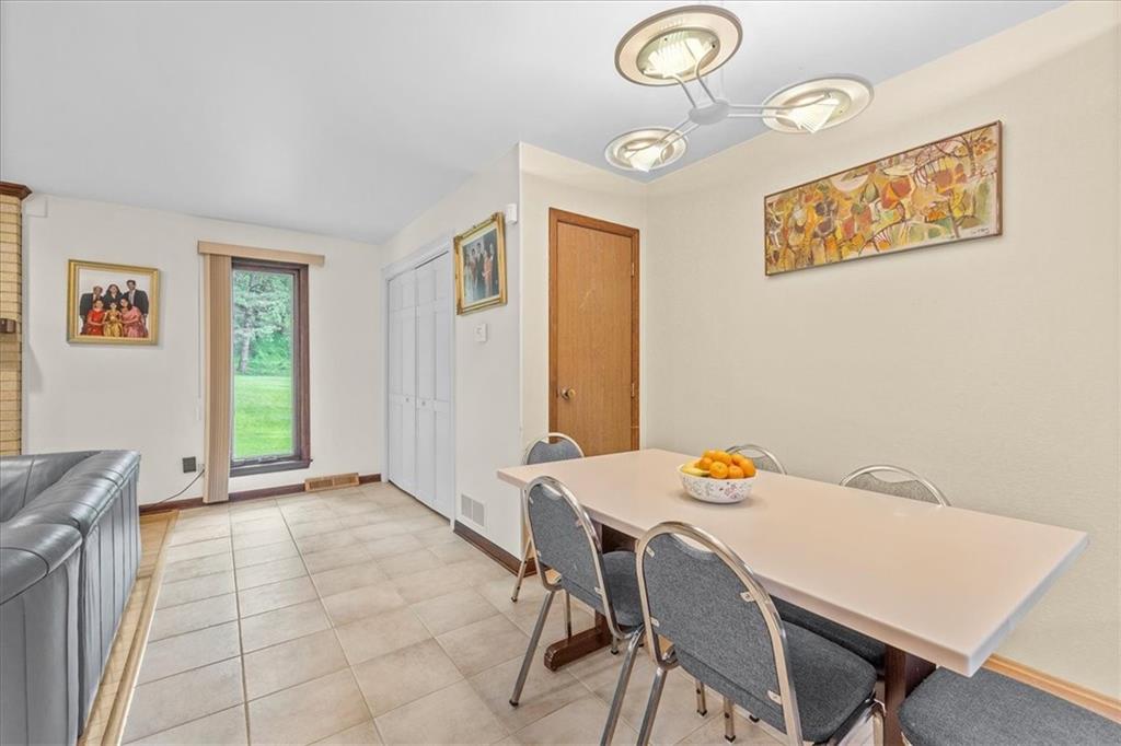 216 Springhouse Lane Pittsburgh, PA 15238 - Photo 11 of 25 a view of a dining room with furniture and a window