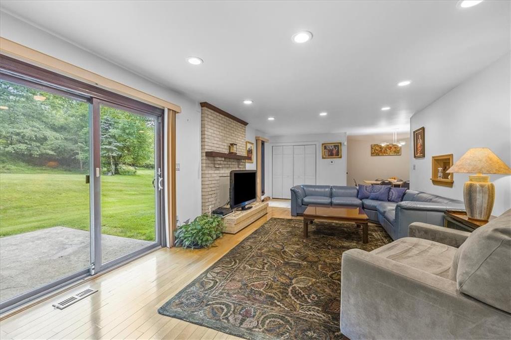 216 Springhouse Lane Pittsburgh, PA 15238 - Photo 12 of 25 a living room with furniture and a floor to ceiling window
