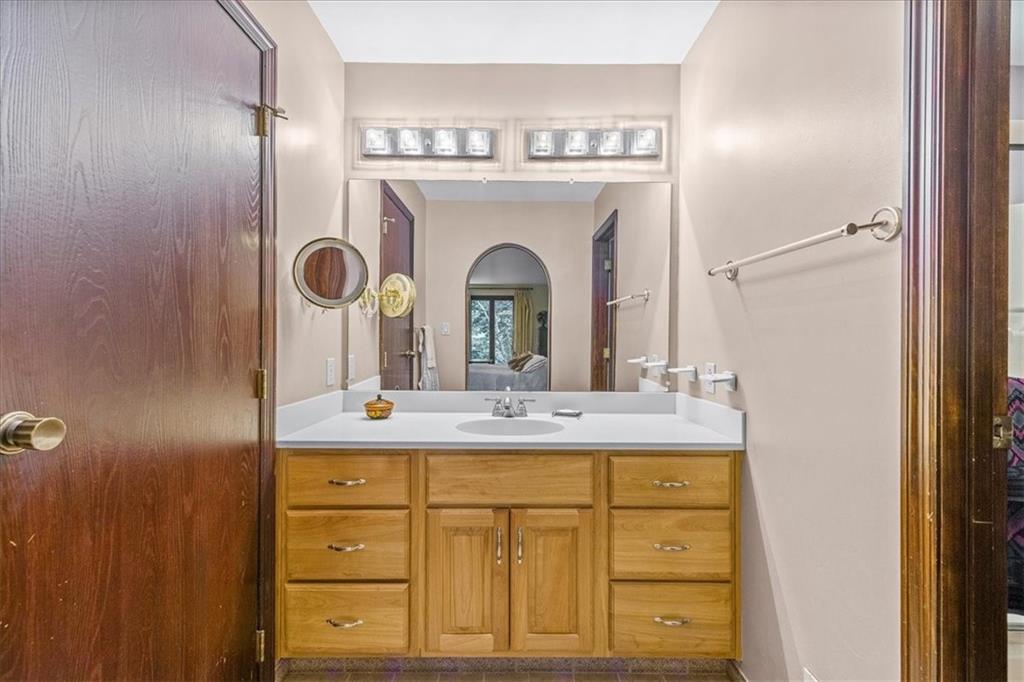 216 Springhouse Lane Pittsburgh, PA 15238 - Photo 19 of 25 a view of a sink and mirror with cabinets
