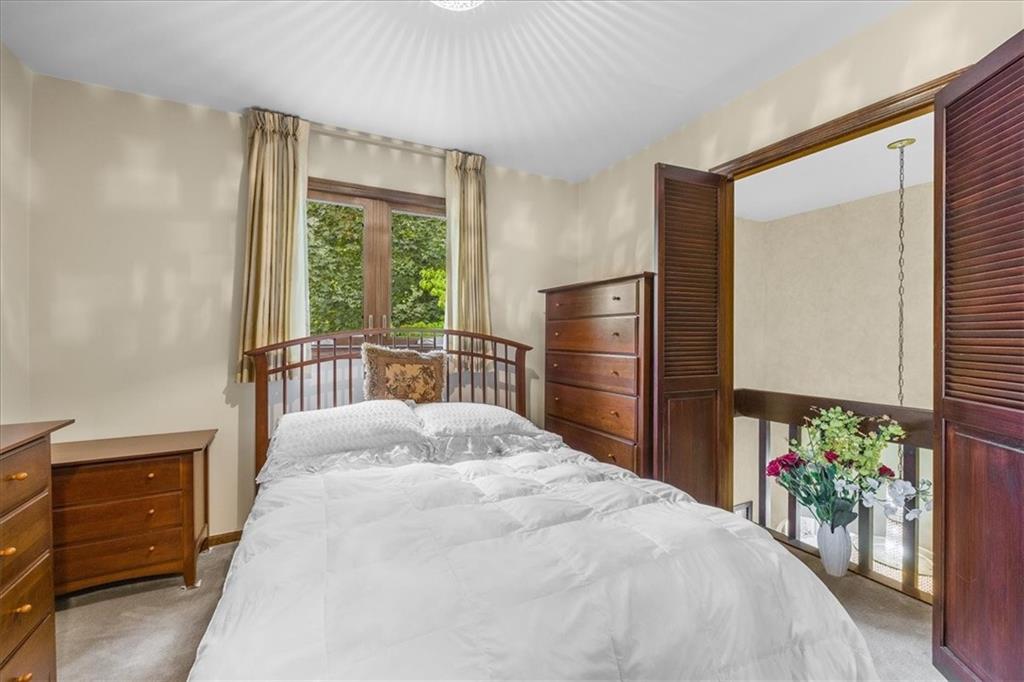 216 Springhouse Lane Pittsburgh, PA 15238 - Photo 21 of 25 a bedroom with a bed and a window