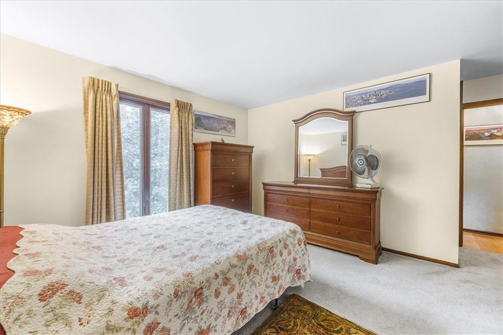 216 Springhouse Lane Pittsburgh, PA 15238 - Photo 22 of 25 a bedroom with a bed and a dresser