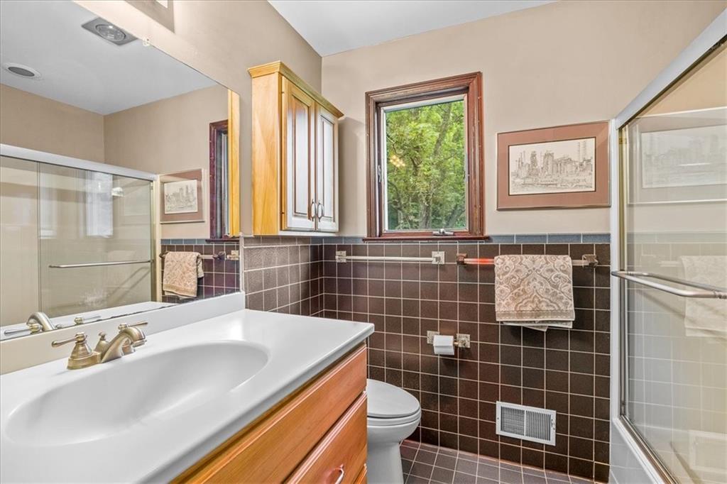 216 Springhouse Lane Pittsburgh, PA 15238 - Photo 23 of 25 a bathroom with a sink a toilet and window