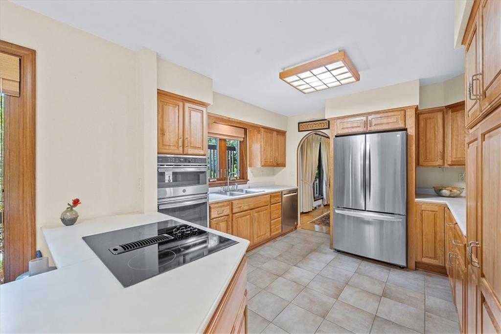 216 Springhouse Lane Pittsburgh, PA 15238 - Photo 7 of 25 a kitchen with a refrigerator sink and cabinets