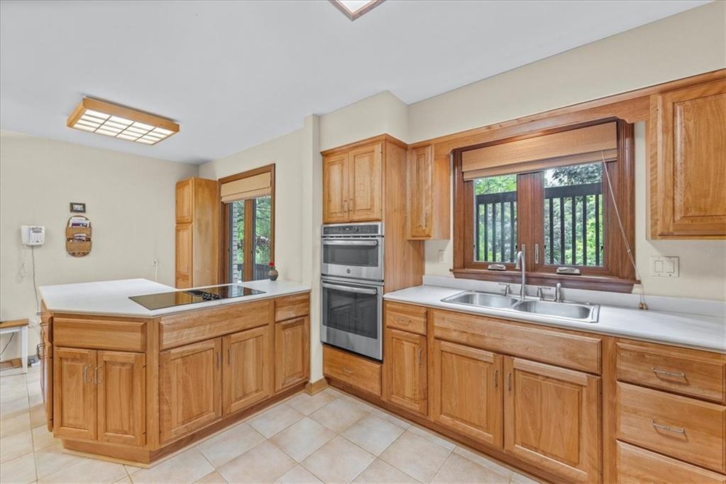 216 Springhouse Lane Pittsburgh, PA 15238 - Photo 8 of 25 a kitchen with cabinets and window