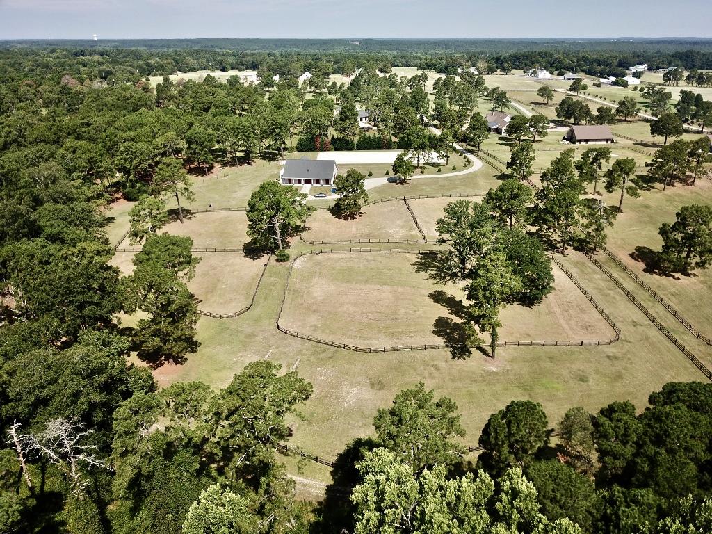 949 Sheldon Road Southern Pines, NC 28387 - Photo 5 of 40 View is from edge of Foundation looking over 4 paddocks and one pasture. The kennels and Mile-A-Way farm are the background fields.