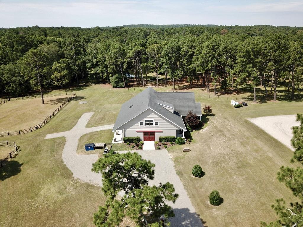 949 Sheldon Road Southern Pines, NC 28387 - Photo 6 of 40 Huntbox sits between dressage flat and paddocks separating barn from Foundation. Property is bordered by Walthour Moss Foundation.