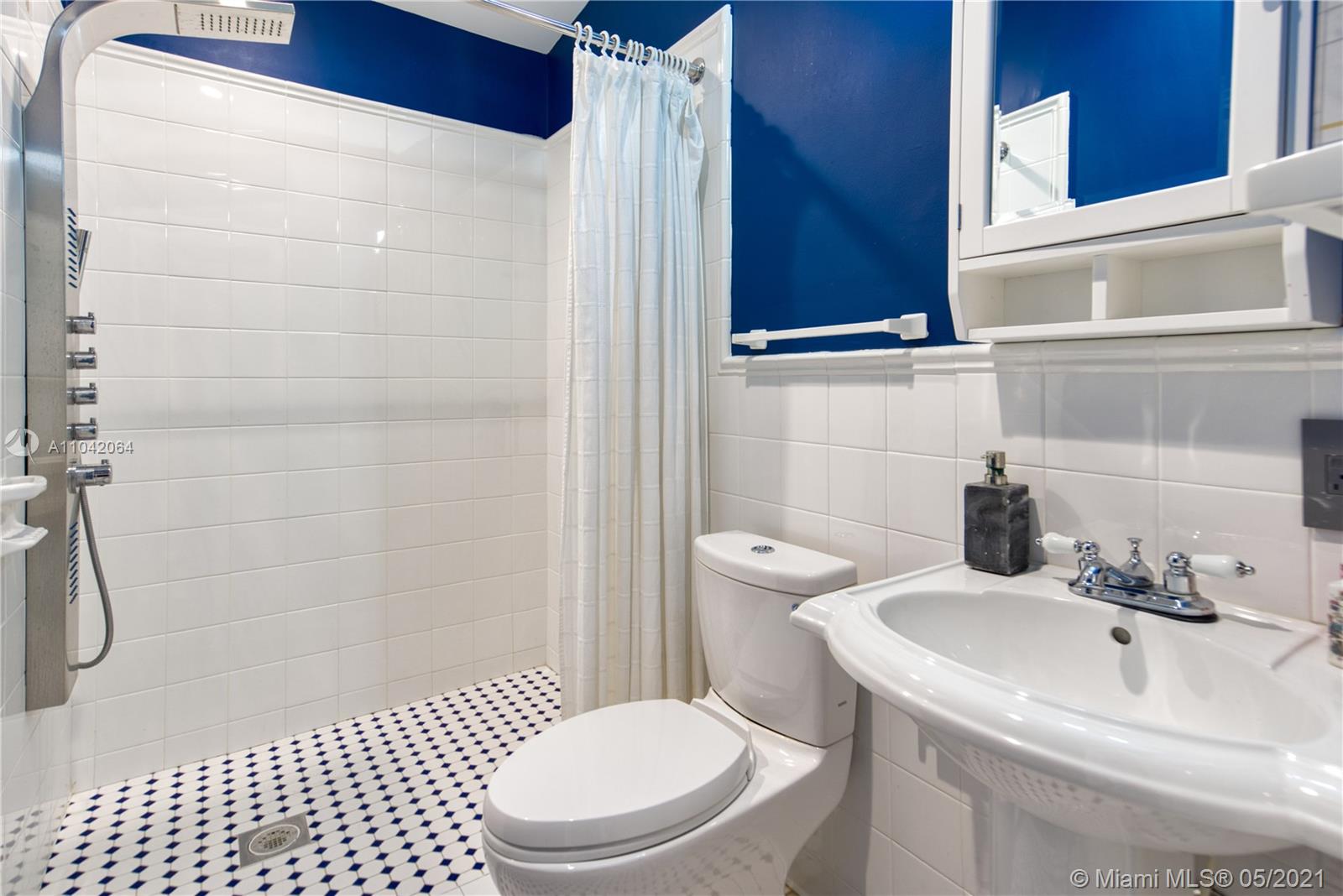 12901 Oleander Road North Miami, FL 33181 - Photo 14 of 22 a bathroom with a sink a toilet and shower