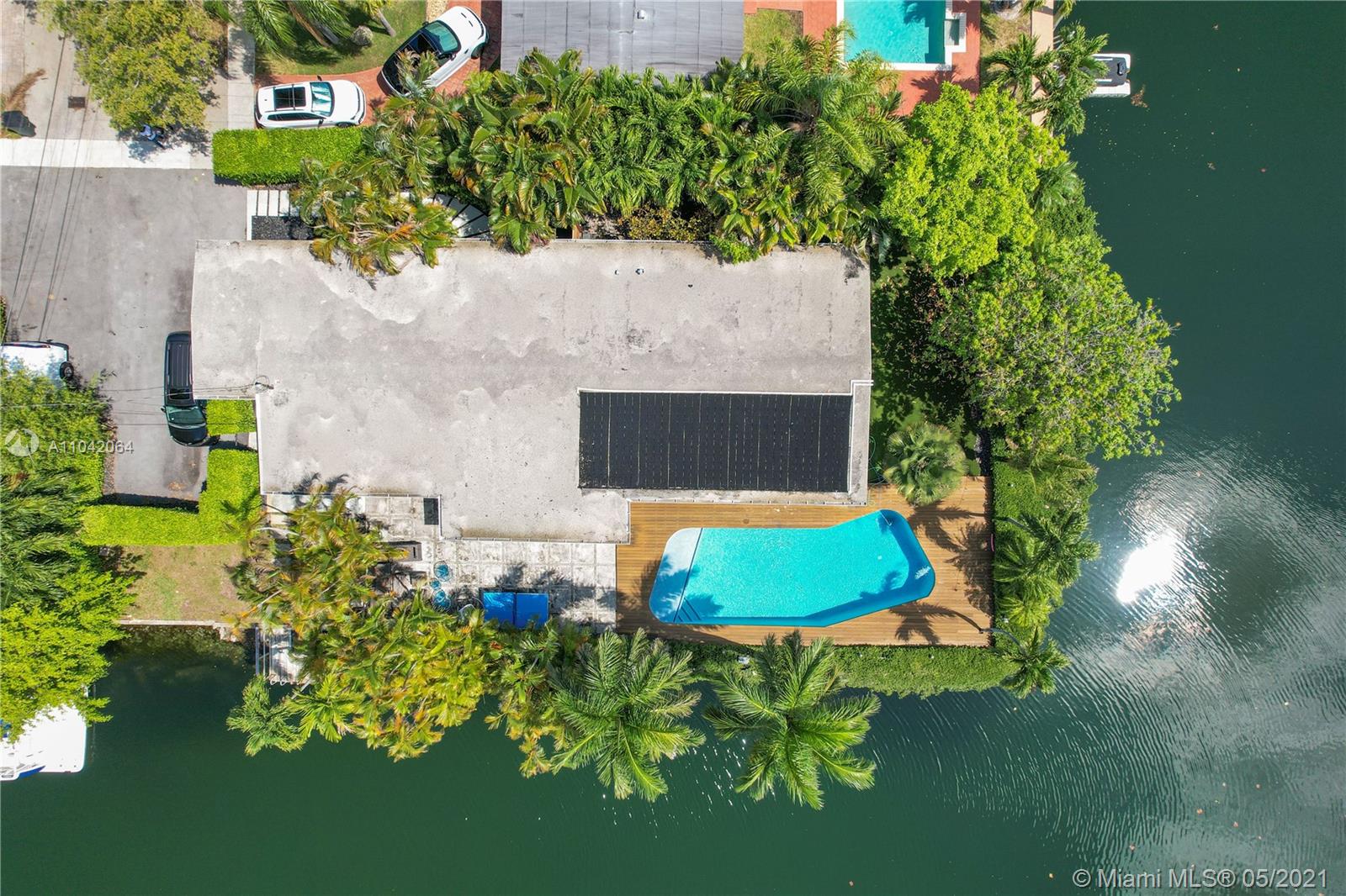 12901 Oleander Road North Miami, FL 33181 - Photo 22 of 22 an aerial view of a house with swimming pool and garden