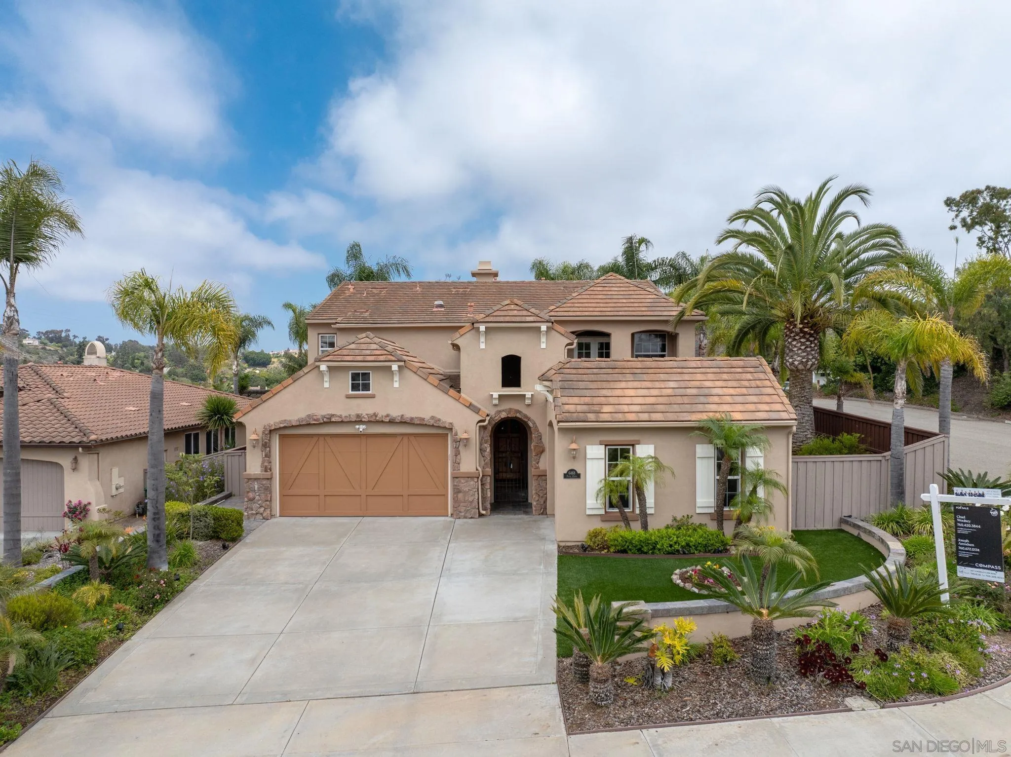 6468 Paseo Cerro Carlsbad, CA 92009 - Photo 1 of 39 a front view of a house with a yard and garage