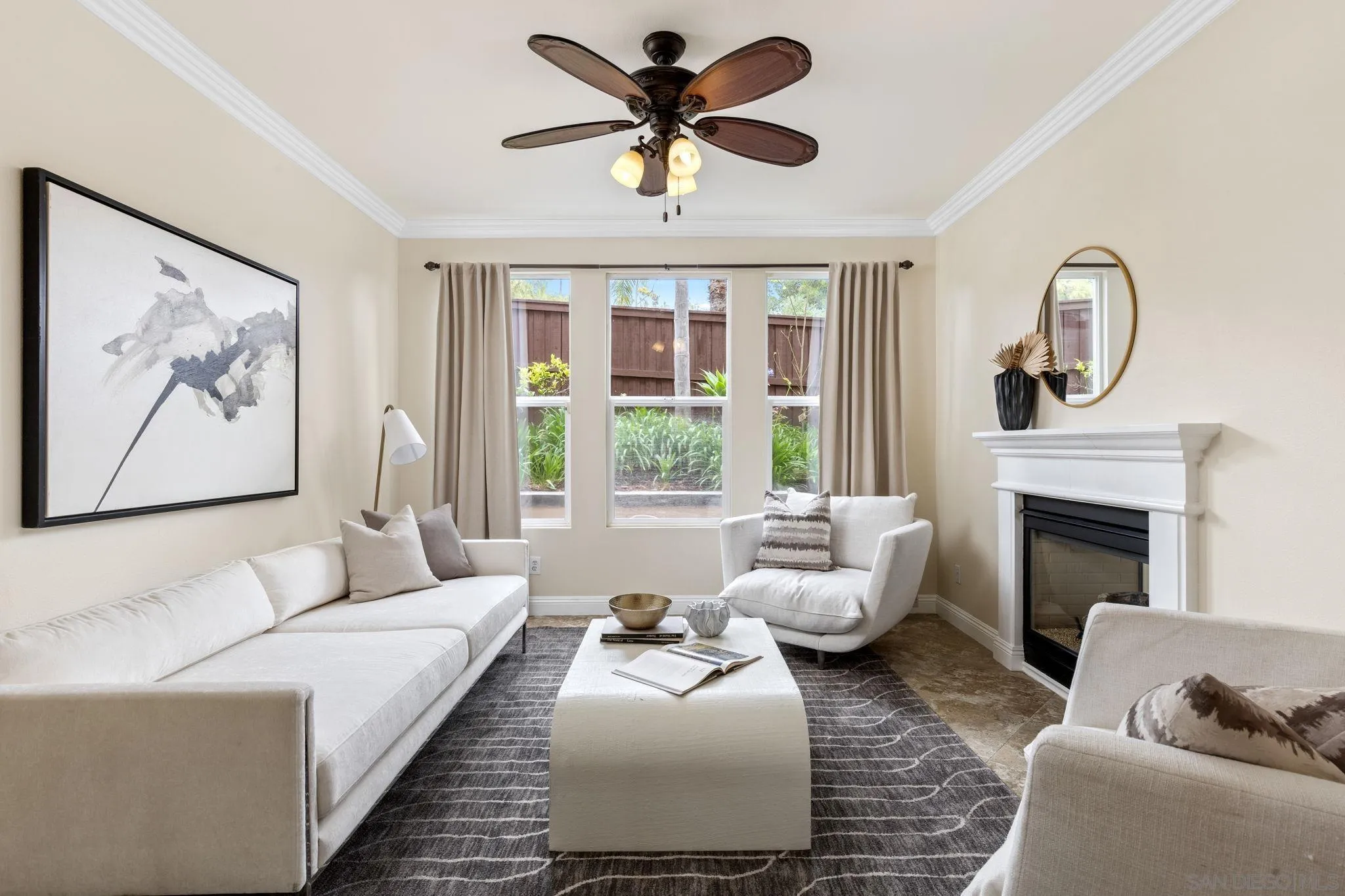 6468 Paseo Cerro Carlsbad, CA 92009 - Photo 14 of 39 a living room with furniture a large window and a fireplace