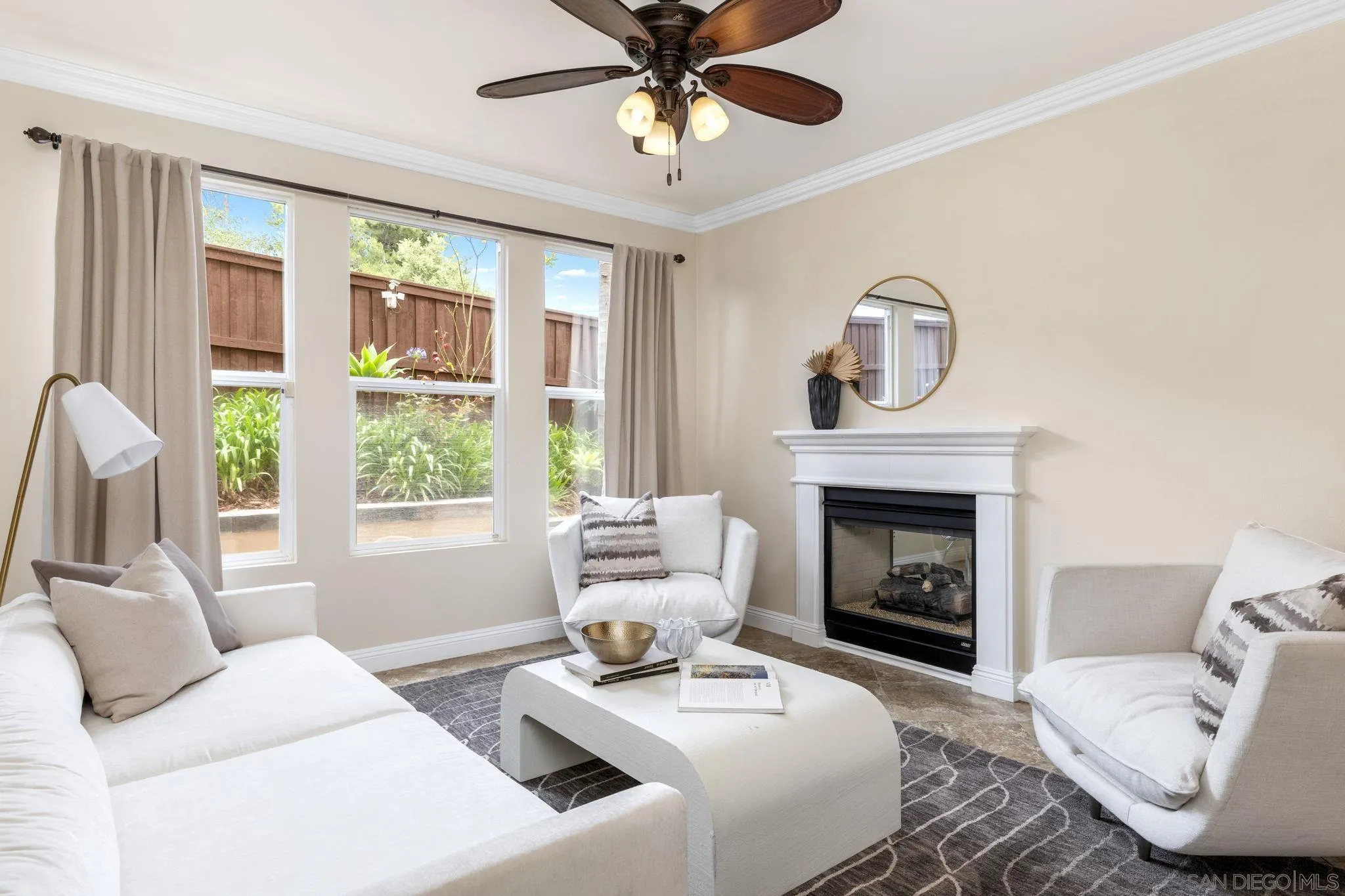 6468 Paseo Cerro Carlsbad, CA 92009 - Photo 15 of 39 a living room with furniture and a fireplace