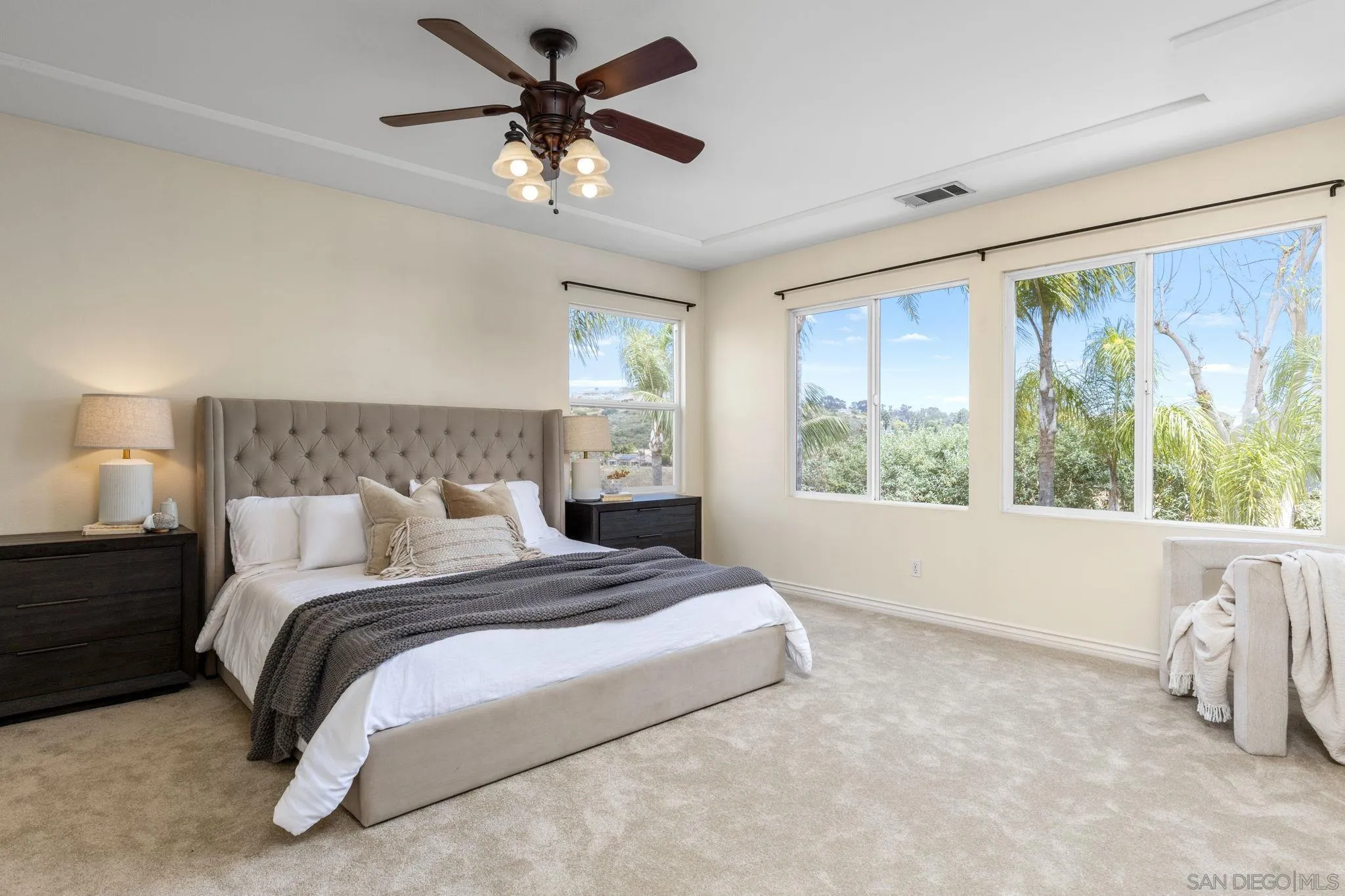 6468 Paseo Cerro Carlsbad, CA 92009 - Photo 19 of 39 a bedroom with a large bed and a large window