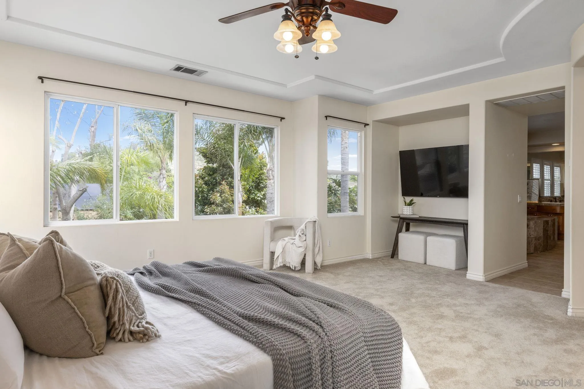 6468 Paseo Cerro Carlsbad, CA 92009 - Photo 20 of 39 a spacious bedroom with a large bed and a flat screen tv