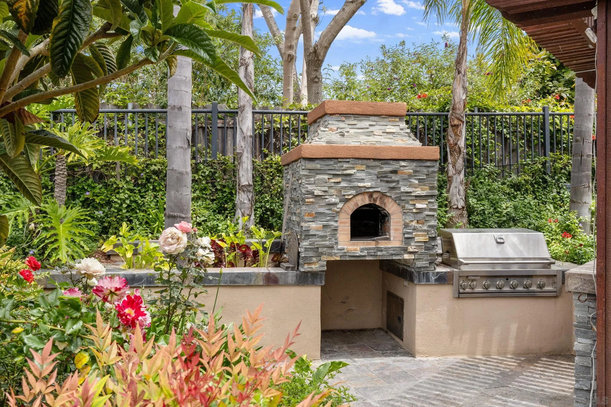 6468 Paseo Cerro Carlsbad, CA 92009 - Photo 3 of 39 a building view with a garden space