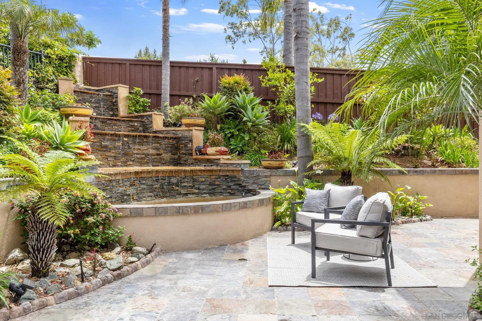 6468 Paseo Cerro Carlsbad, CA 92009 - Photo 31 of 39 a view of a chairs and table in a backyard