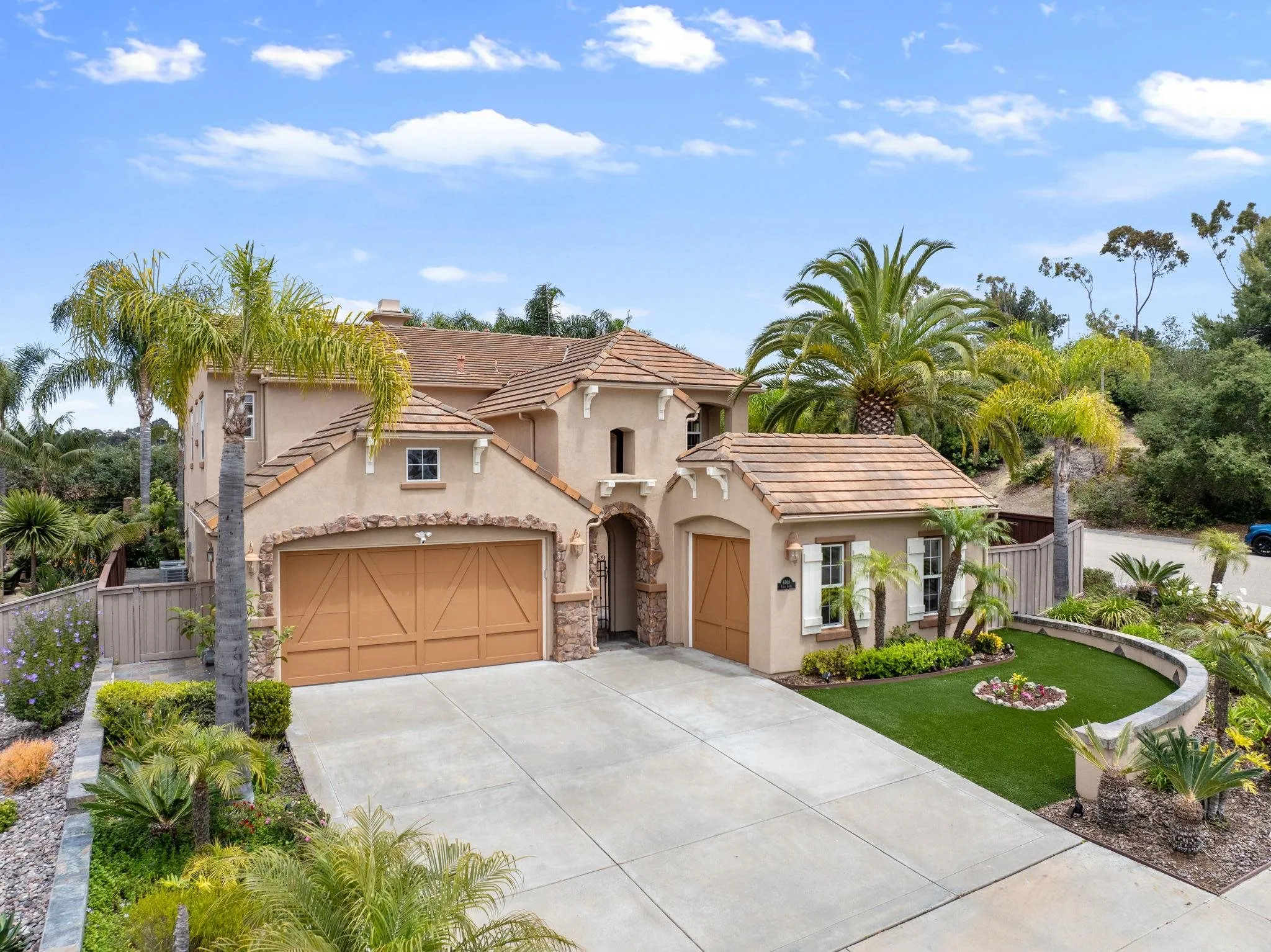 6468 Paseo Cerro Carlsbad, CA 92009 - Photo 5 of 39 a front view of a house with a yard and garage