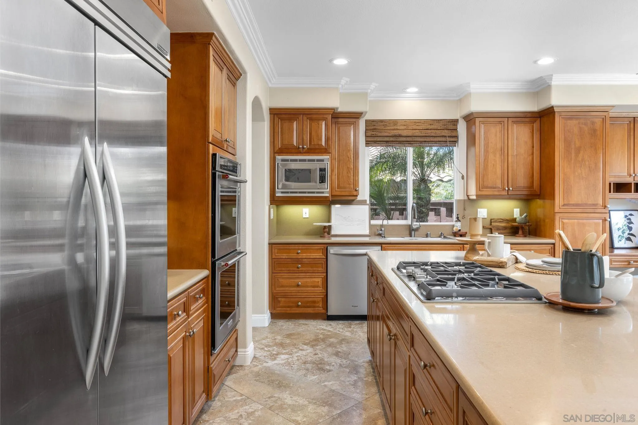6468 Paseo Cerro Carlsbad, CA 92009 - Photo 8 of 39 a kitchen with stainless steel appliances granite countertop a refrigerator a stove and a sink