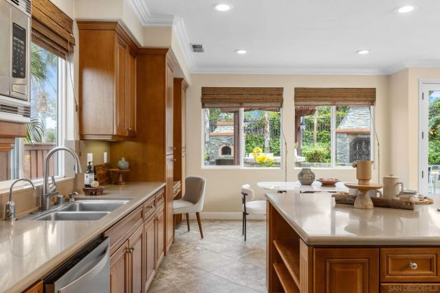 a kitchen with counter top space a sink and cabinets