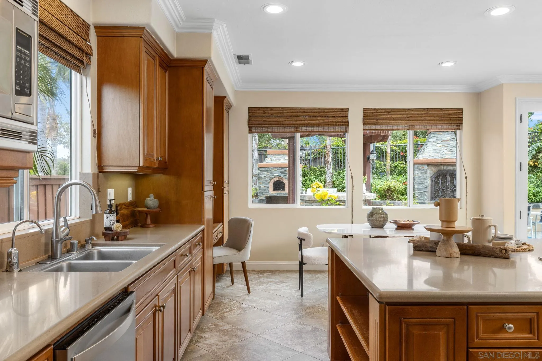 6468 Paseo Cerro Carlsbad, CA 92009 - Photo 9 of 39 a kitchen with counter top space a sink and cabinets