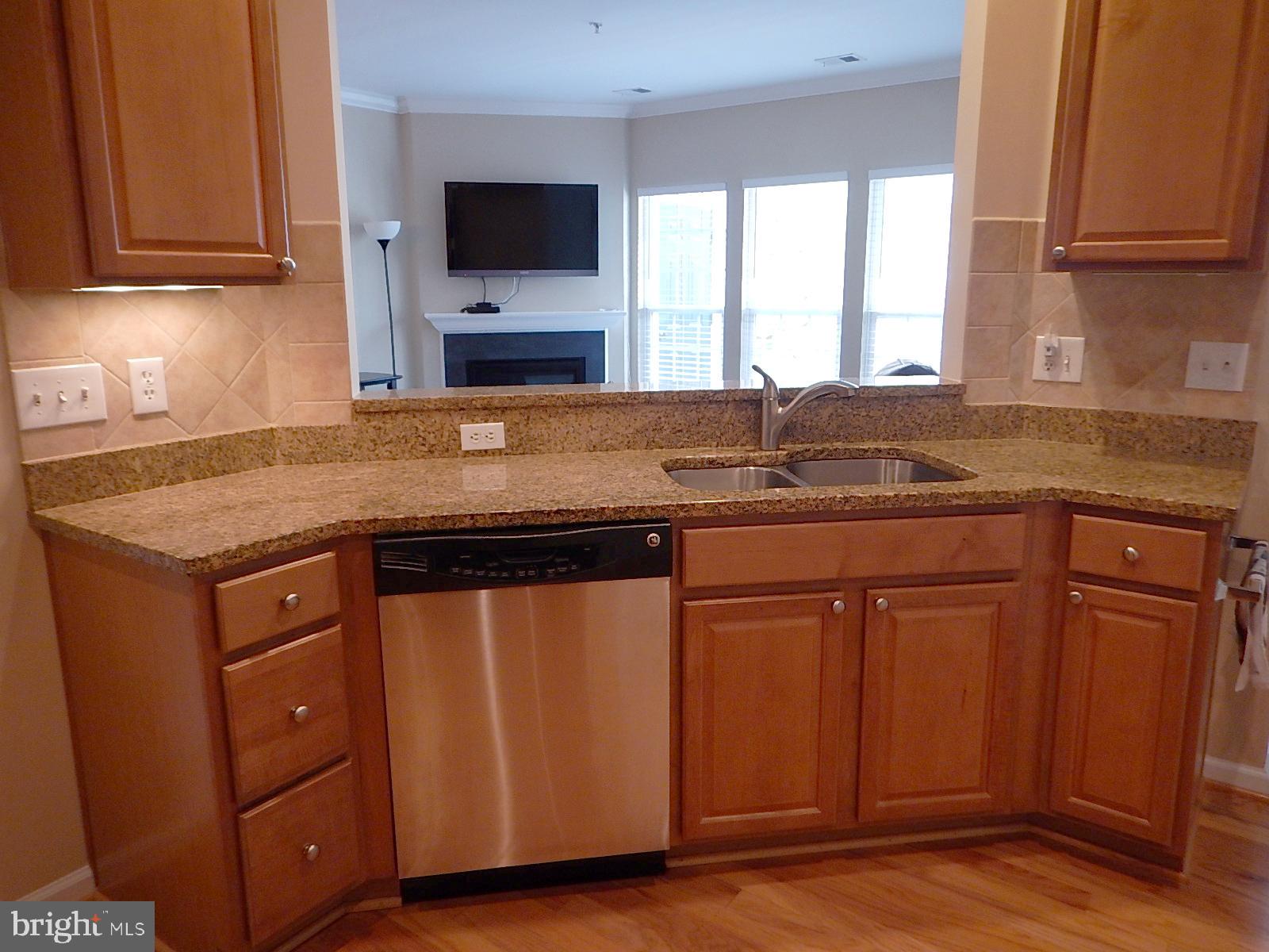 633 Wallingford Road, Unit 201 Bel Air, MD 21014 - Photo 9 of 38 a kitchen with stainless steel appliances granite countertop a sink stove and cabinets