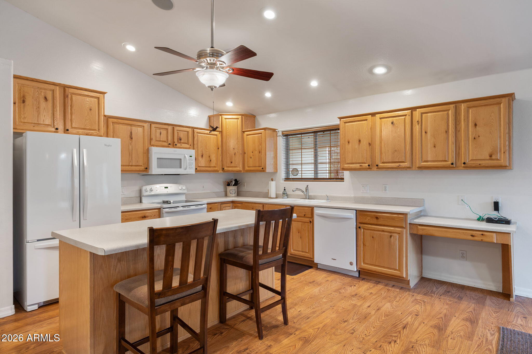 2236 Cross Country Road Overgaard, AZ 85933 - Photo 13 of 59 a kitchen with stainless steel appliances granite countertop a sink a stove a refrigerator cabinets and chairs