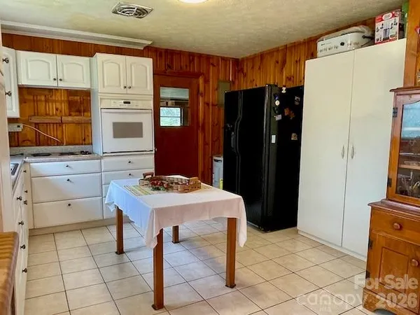 a kitchen with a cabinets and appliances
