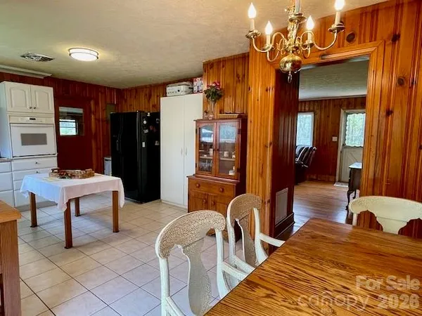 a bedroom with furniture and a chandelier