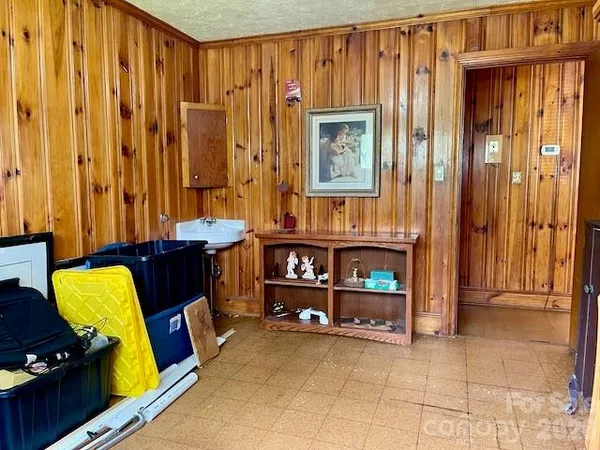 a view of a bedroom with furniture and a window