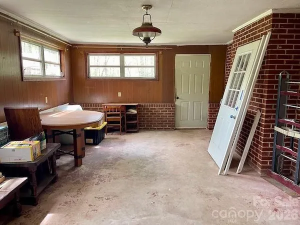 a view of a livingroom with furniture and white walls