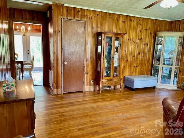 a view of living room with furniture and wooden floor