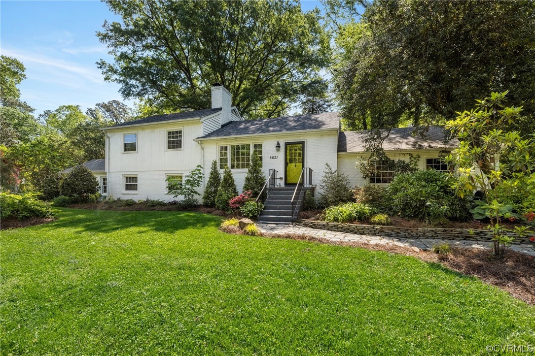 8621 Fieldcrest Road Richmond, VA 23235 - Photo 2 of 44 a backyard of a house with garden and barbeque oven