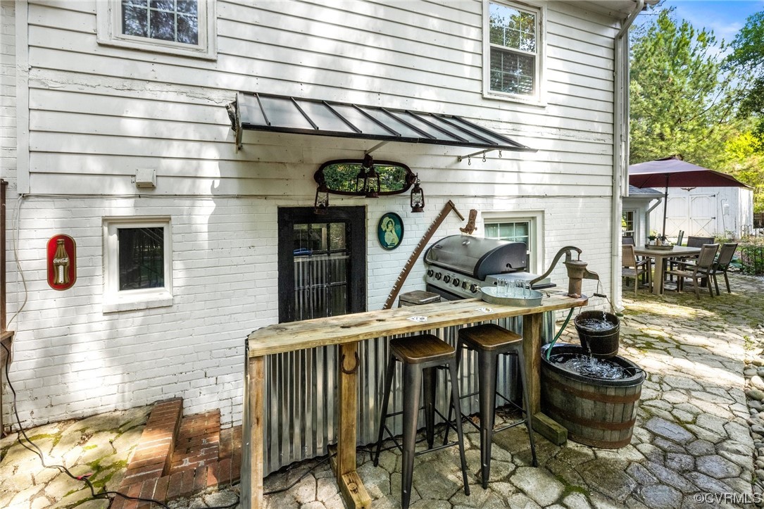 8621 Fieldcrest Road Richmond, VA 23235 - Photo 27 of 44 a front view of a house with patio