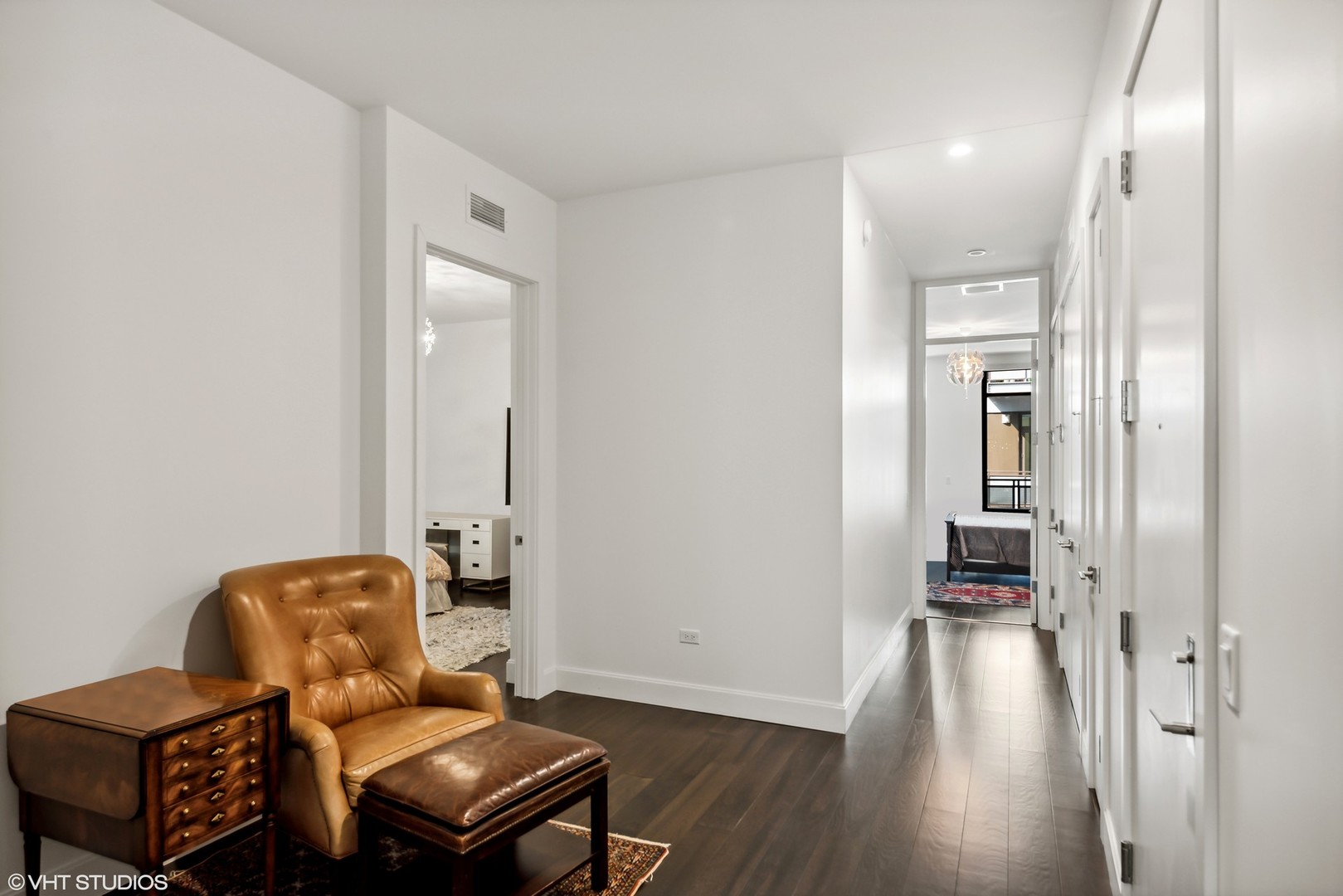 40 North Carpenter Street, Unit 4S Chicago, IL 60607 - Photo 11 of 25 a hallway with chairs and wooden floor