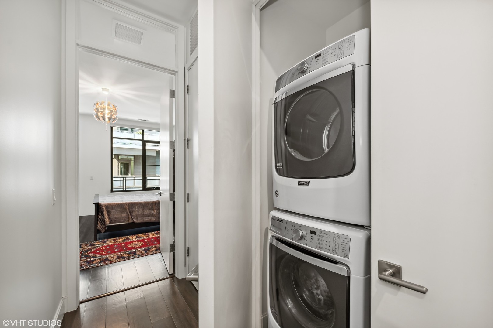40 North Carpenter Street, Unit 4S Chicago, IL 60607 - Photo 12 of 25 a view of a utility room with washer and dryer
