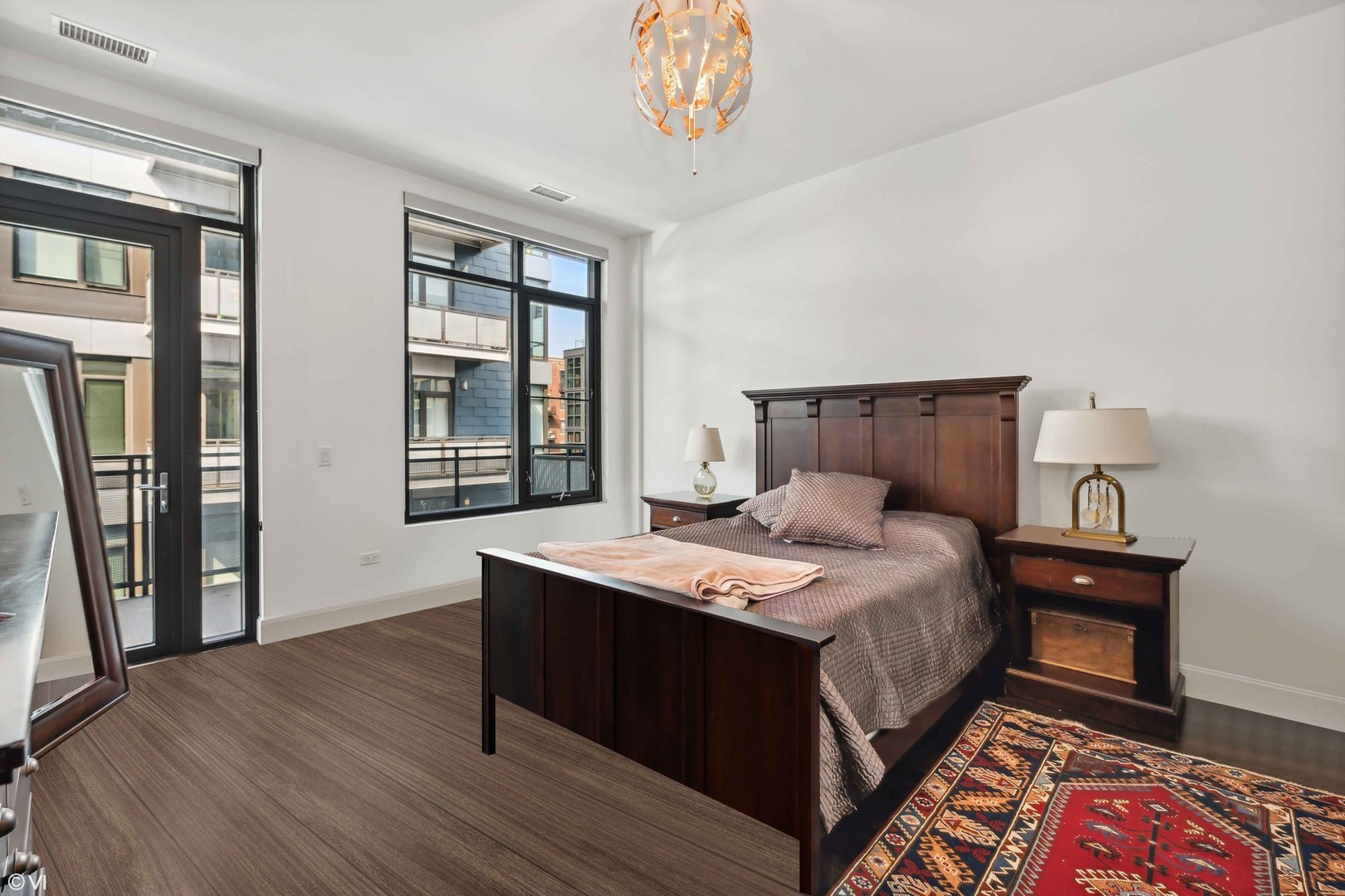 40 North Carpenter Street, Unit 4S Chicago, IL 60607 - Photo 13 of 25 a bedroom with a bed and a table in it
