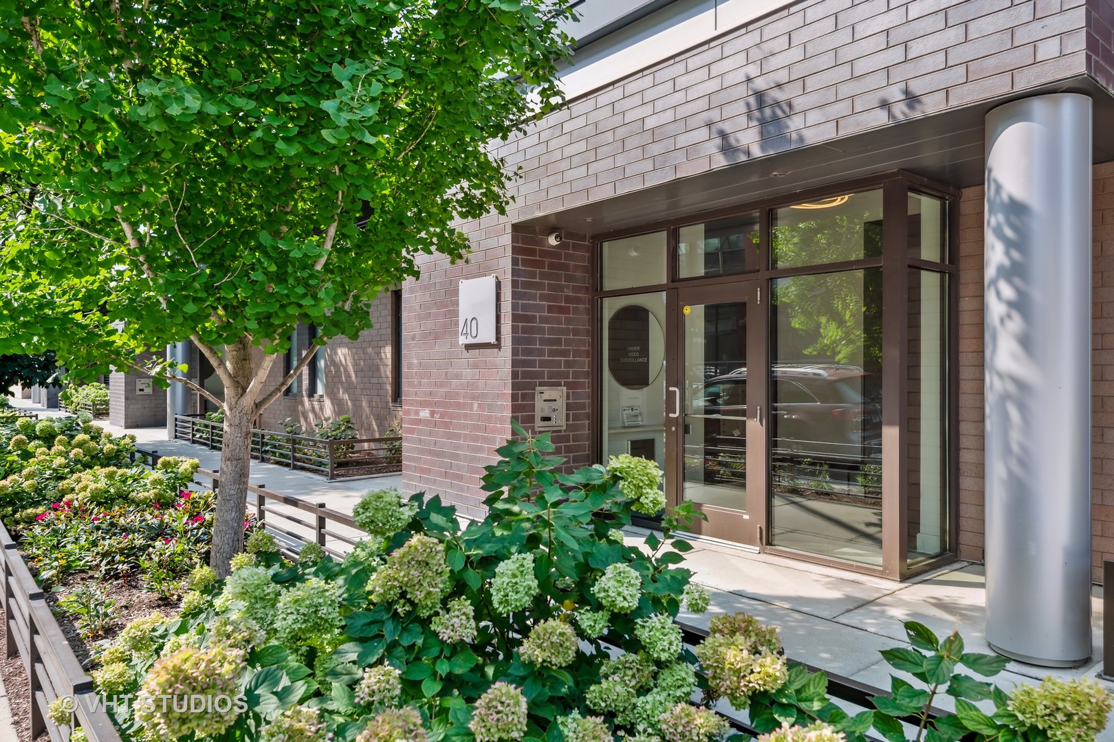 40 North Carpenter Street, Unit 4S Chicago, IL 60607 - Photo 2 of 25 front view of a house with a garden