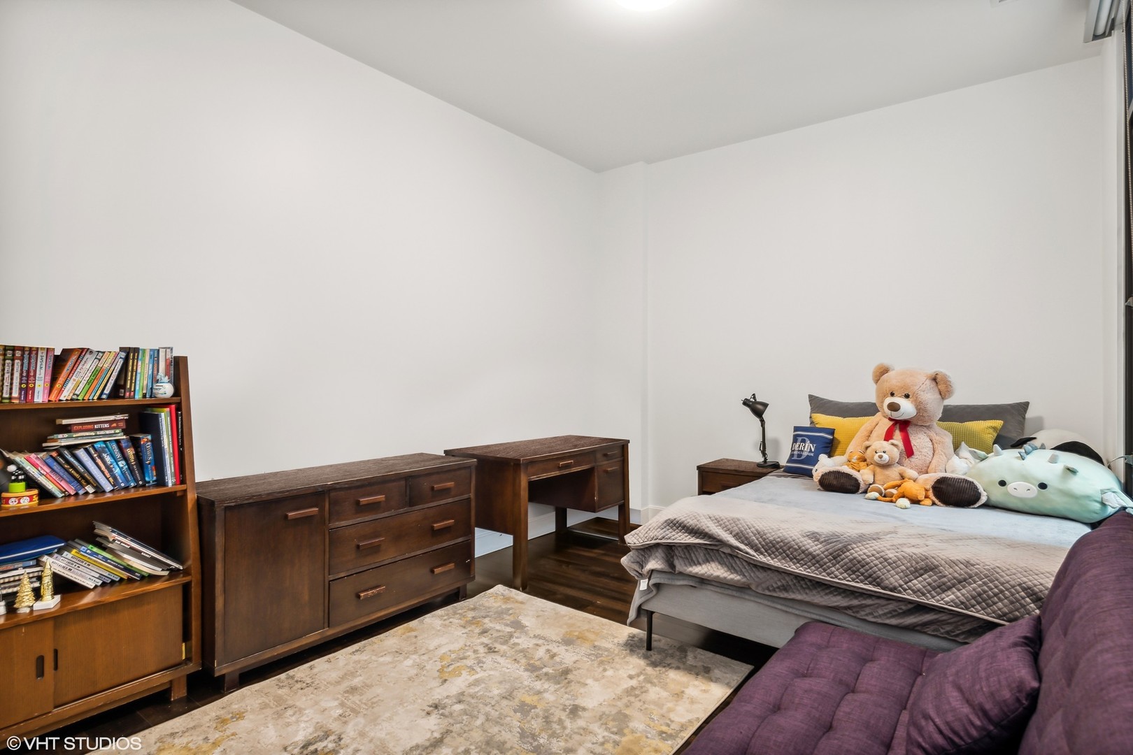 40 North Carpenter Street, Unit 4S Chicago, IL 60607 - Photo 21 of 25 a bedroom with a bed and a book shelf