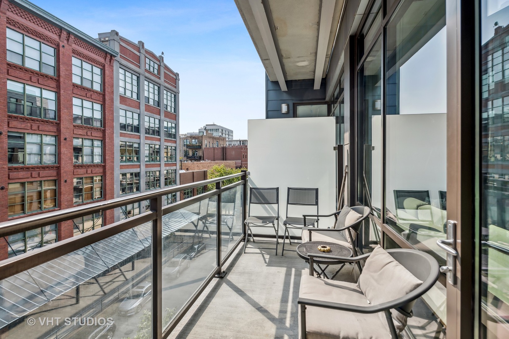 40 North Carpenter Street, Unit 4S Chicago, IL 60607 - Photo 23 of 25 a view of a balcony with chairs