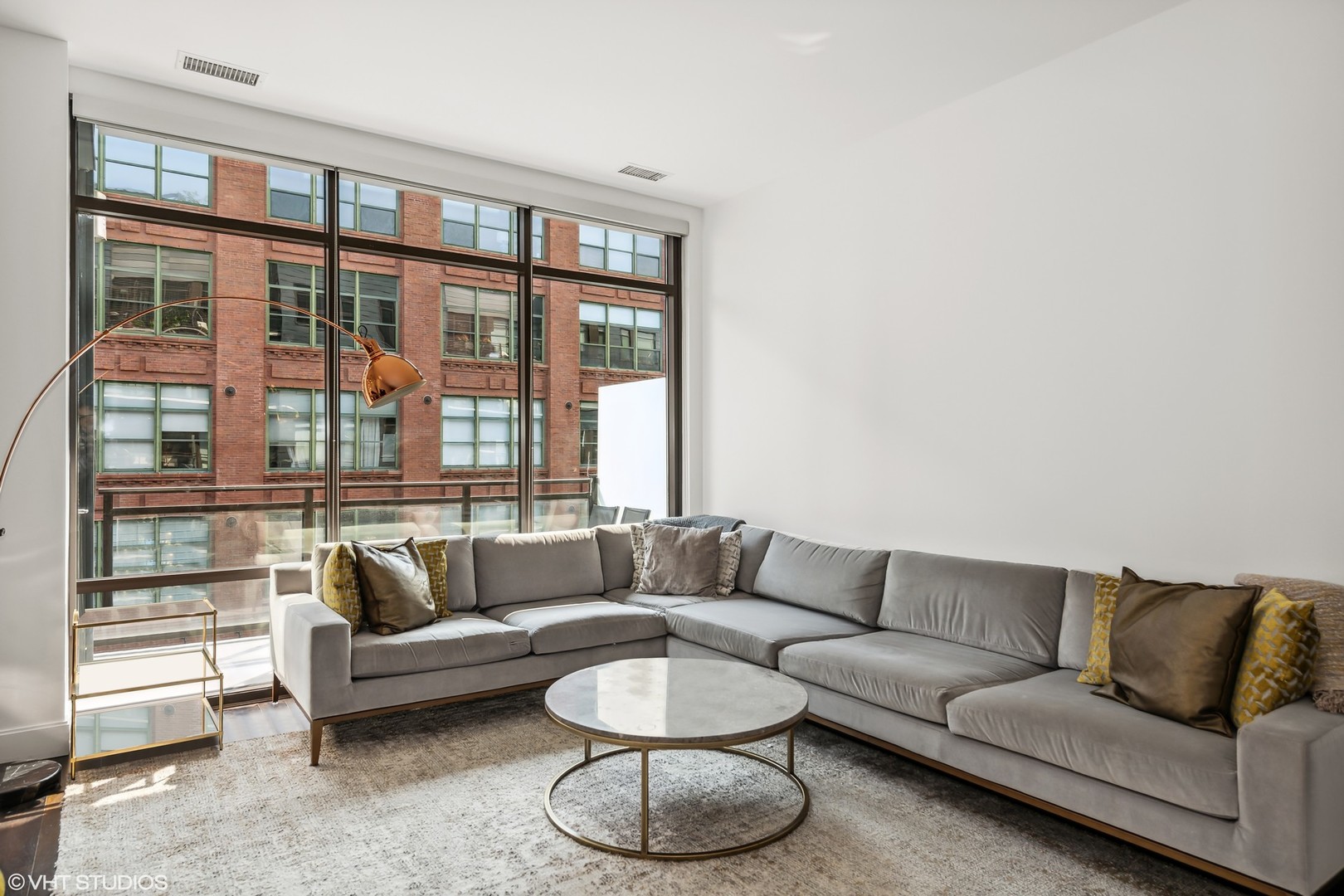 40 North Carpenter Street, Unit 4S Chicago, IL 60607 - Photo 5 of 25 a living room with furniture and a large window